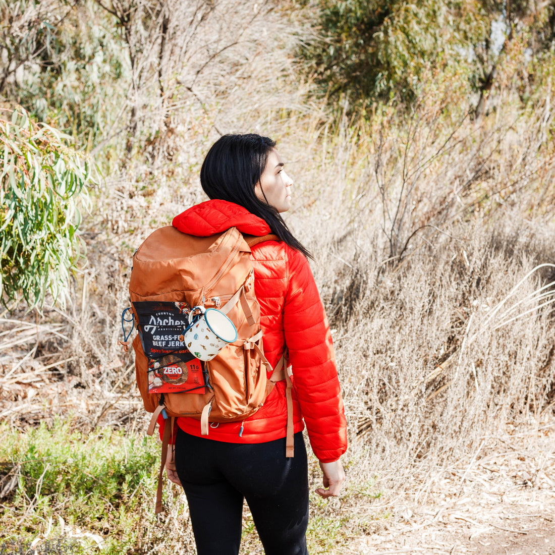 backpacker with country archer beef jerky snacks