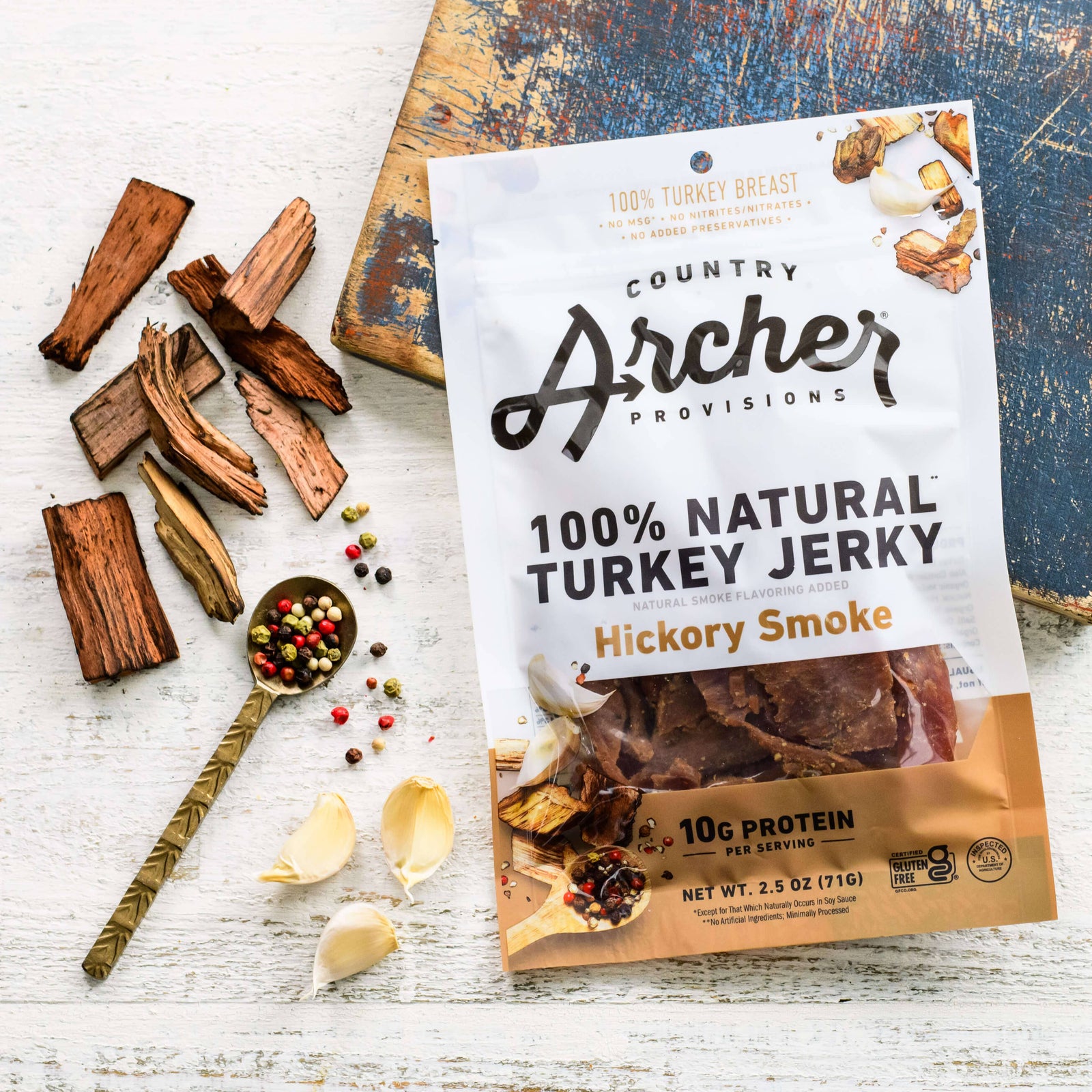 Country Archer Turkey Jerky 2.5 oz package on countertop with spices